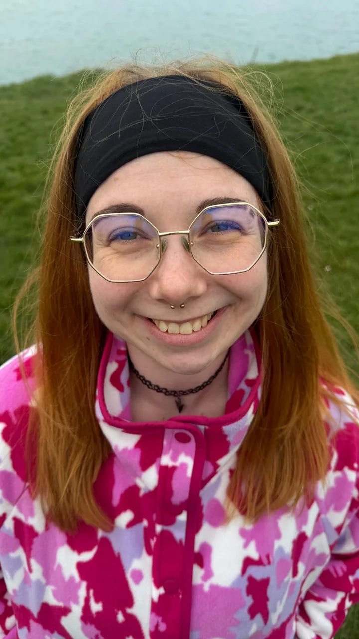 Lena smiling outside in nature